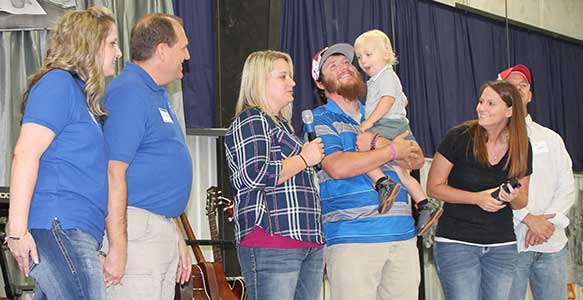 Kayla and Casey Jones receiving Overcomer Award