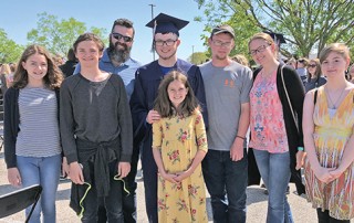 Decorated graduation caps denote pride in family, education in El Paso
